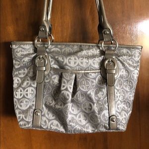 Silver colored purse.